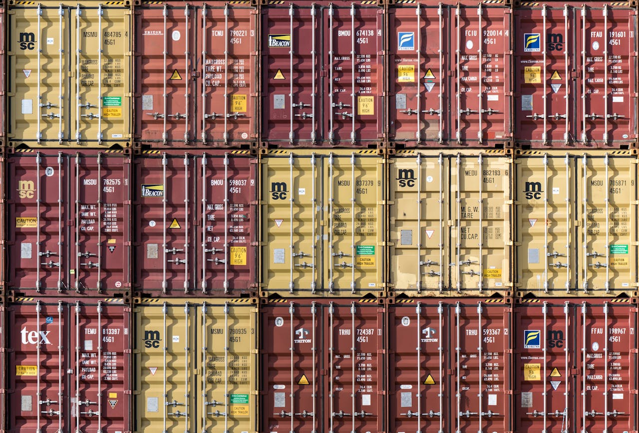 About Rows of stacked shipping containers at Hamburg port. Industrial and international trade imagery.