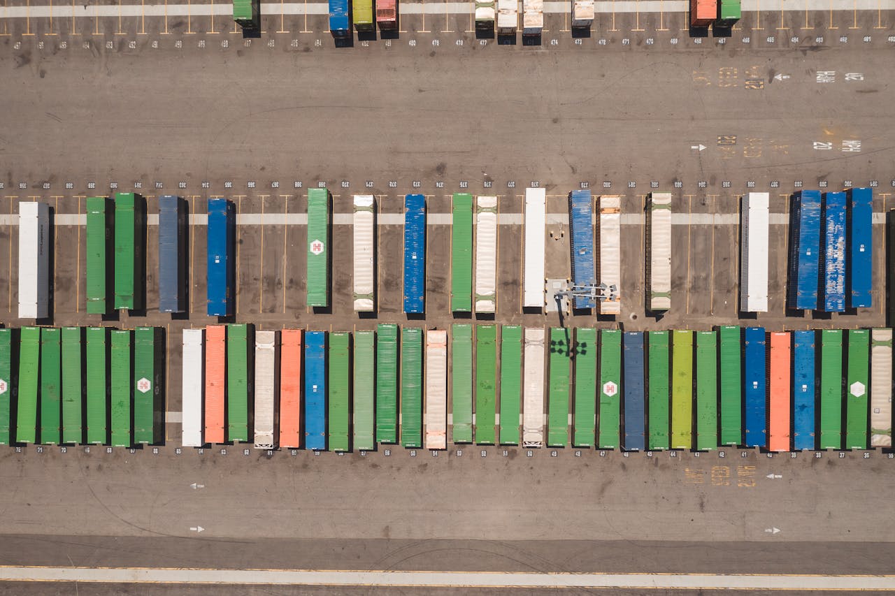 Crafting Captivating Headlines: Your awesome post title goes here Top view of neatly arranged cargo containers in a shipping port, highlighting logistics and global trade.
