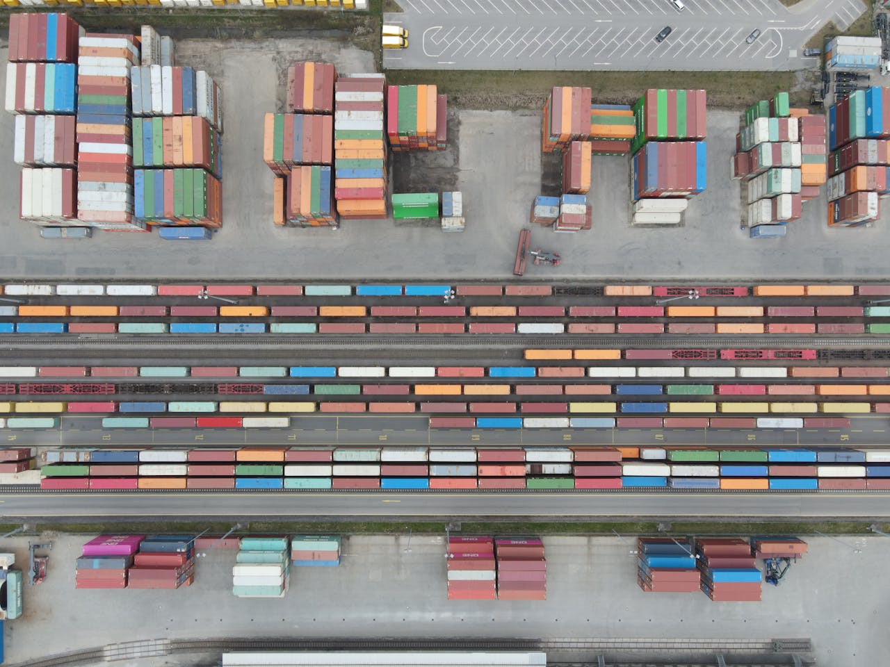 Mastering the First Impression: Your intriguing post title goes here Aerial shot of stacked cargo containers at Regensburg port showcasing freight transport activity.